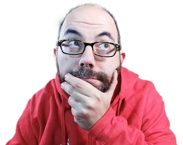 Dani Primo con sudadera roja, la mano en la barbilla, pensando